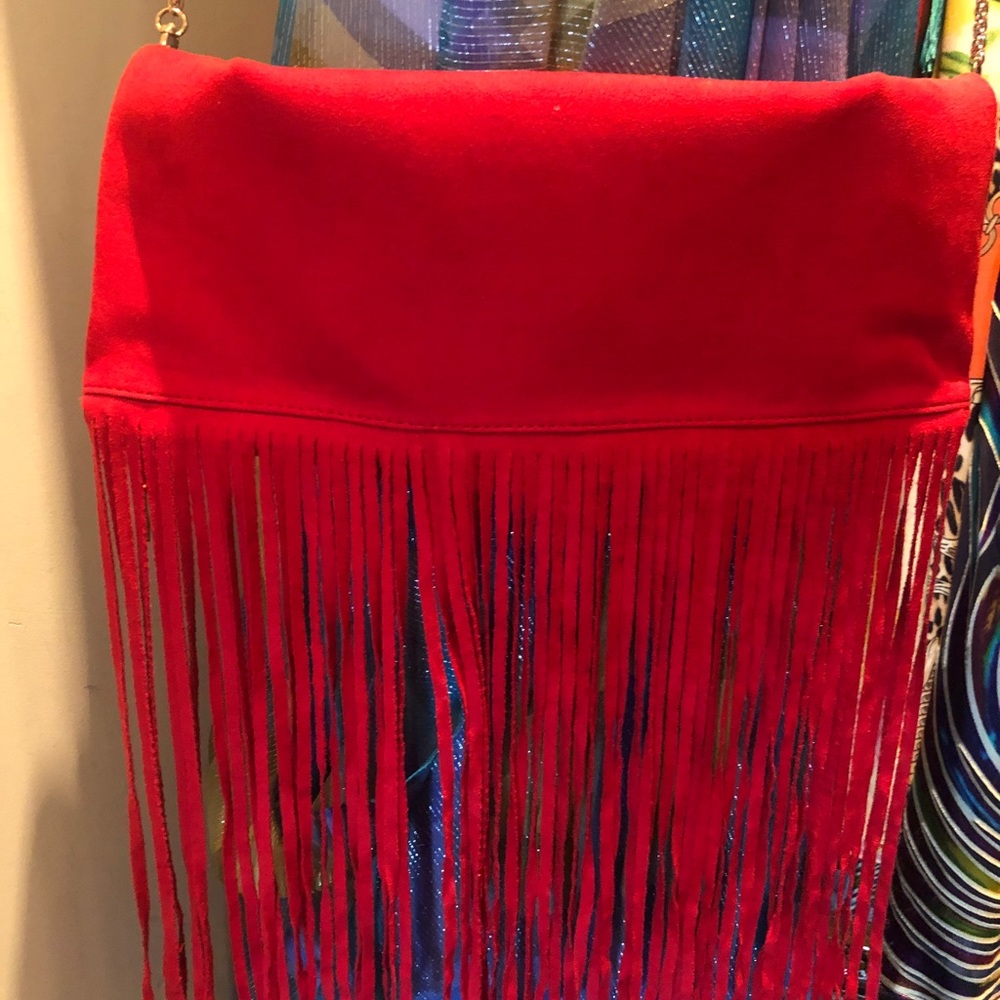Chic red handbag.wear as a clutch, crossbody or shoulder.  fringe for pop of fun